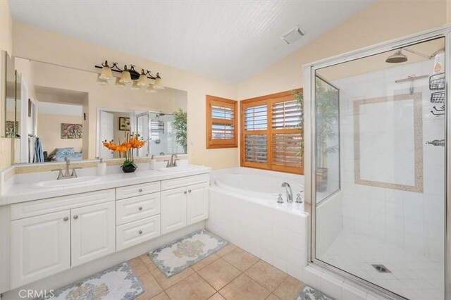 14209 Wrangell Ln, Canyon Country, CA 91387 - full bath with a shower stall, tile patterned floors, a garden tub, double vanity, and vaulted ceiling