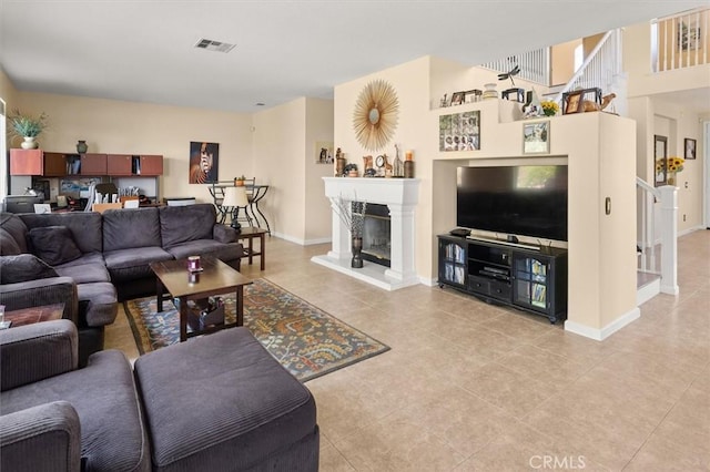 14209 Wrangell Ln, Canyon Country, CA 91387 - living room with light tile patterned flooring, baseboards, and a glass covered fireplace