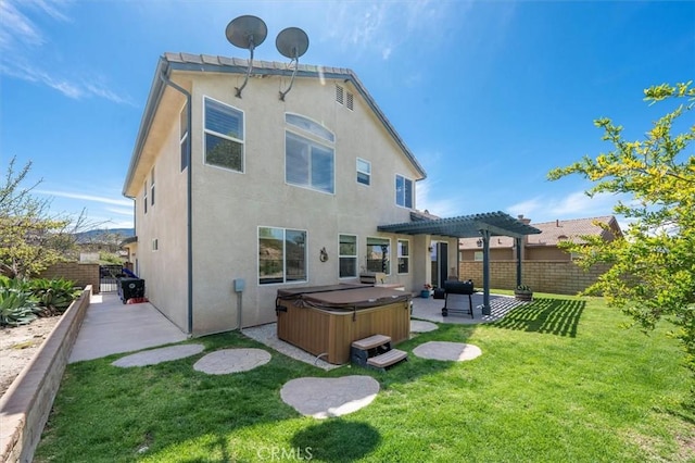14209 Wrangell Ln, Canyon Country, CA 91387 - back of property featuring a hot tub, stucco siding, a pergola, and a patio area