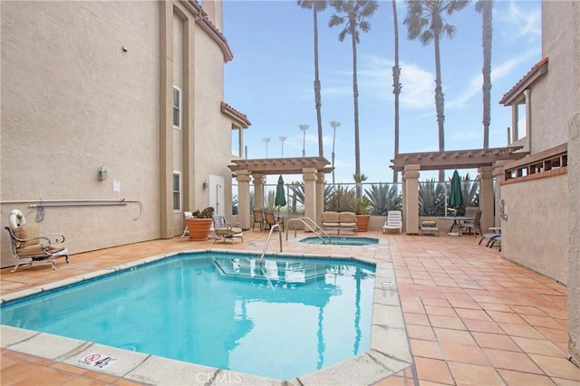 1400 Pacific Coast Unit 305, Huntington Beach, CA 92648 - community pool featuring a pergola, a hot tub, and a patio