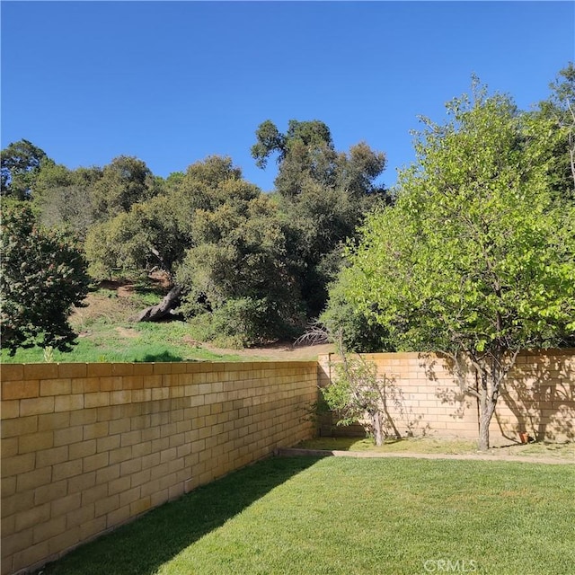 view of yard with fence