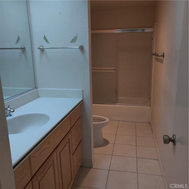 full bath with vanity,  shower combination, tile patterned floors, and toilet