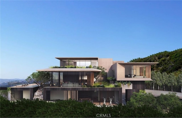 rear view of property with a balcony