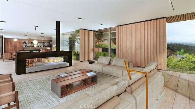 living room featuring light wood finished floors and plenty of natural light