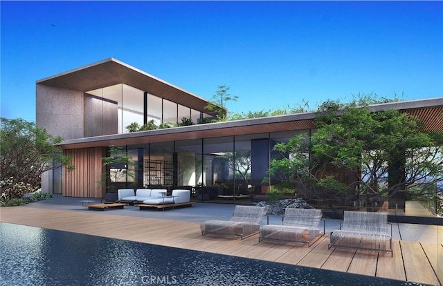 back of property featuring an outdoor hangout area and a wooden deck