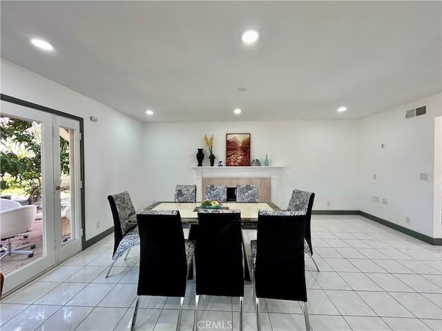 dining space with recessed lighting, light tile patterned floors, visible vents, and baseboards