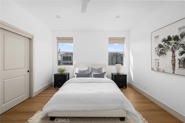 bedroom with recessed lighting, baseboards, a ceiling fan, and light wood-style floors