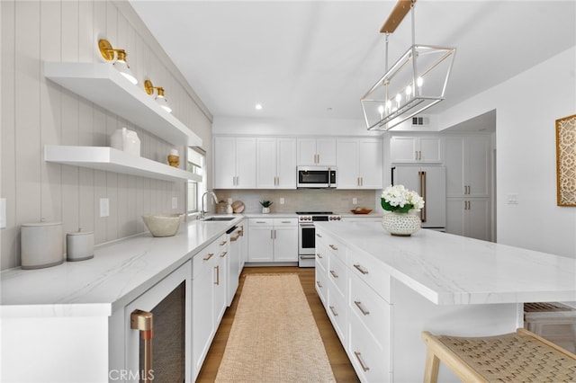 kitchen with electric range oven, open shelves, dishwasher, a sink, and high quality fridge