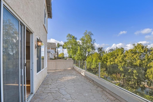 view of patio featuring a balcony