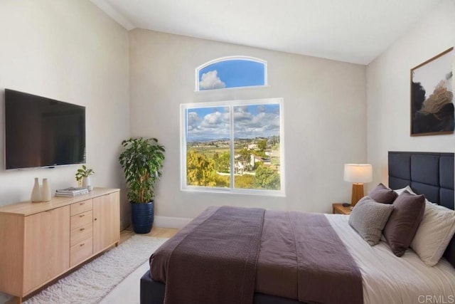 bedroom with lofted ceiling