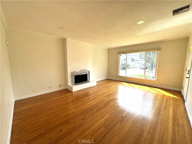 234 Santa Rosa Rd, Arcadia, CA 91007 - unfurnished living room featuring hardwood / wood-style floors, a fireplace with raised hearth, ornamental molding, and visible vents