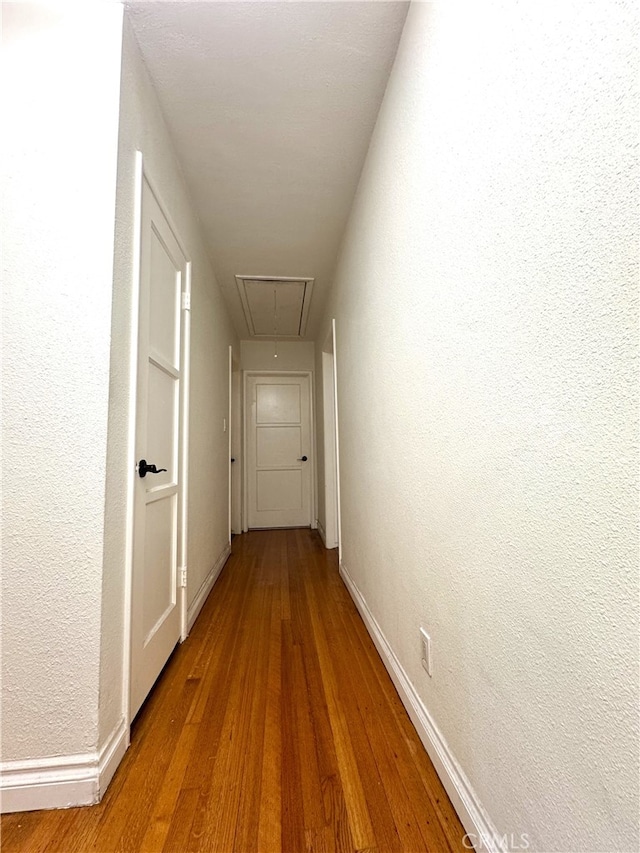 234 Santa Rosa Rd, Arcadia, CA 91007 - hallway featuring wood finished floors, attic access, baseboards, and a textured wall
