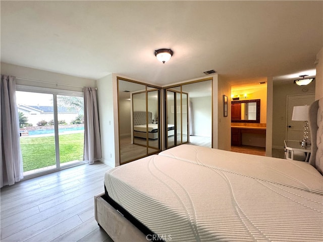 234 Santa Rosa Rd, Arcadia, CA 91007 - bedroom featuring access to exterior, wood finished floors, visible vents, and multiple closets