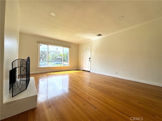 234 Santa Rosa Rd, Arcadia, CA 91007 - unfurnished living room with wood finished floors, baseboards, ornamental molding, and visible vents