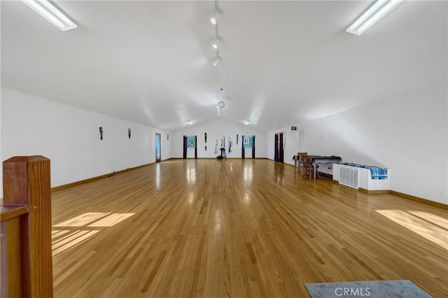 11575 Loch Lomond Rd, Middletown, CA 95461 - additional living space with vaulted ceiling, light wood-style floors, and baseboards