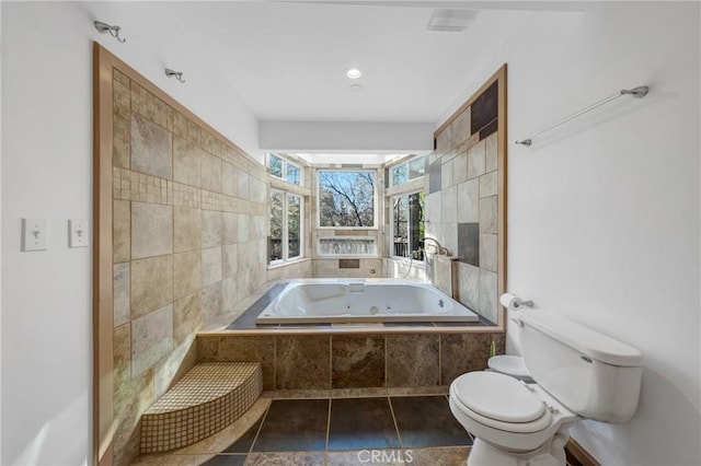 11575 Loch Lomond Rd, Middletown, CA 95461 - bathroom featuring toilet, a jetted tub, and tile walls