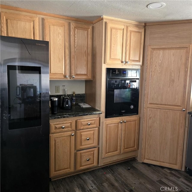 15433 Idaho Ln, Apple Valley, CA 92307 - kitchen with dark stone countertops, dark wood-type flooring, black appliances, and a textured ceiling