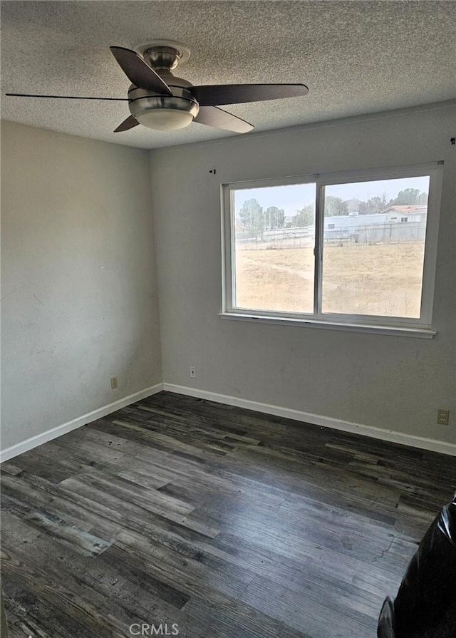 15433 Idaho Ln, Apple Valley, CA 92307 - spare room featuring baseboards, ceiling fan, dark wood-type flooring, and a textured ceiling