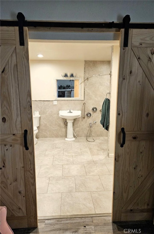 15433 Idaho Ln, Apple Valley, CA 92307 - bathroom featuring tile walls and toilet