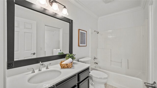 bathroom with shower / washtub combination, washer / clothes dryer, vanity, ornamental molding, and toilet