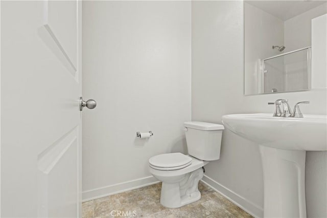 3069 Acebo Dr, Pomona, CA 91767 - bathroom with toilet, baseboards, a sink, and a shower