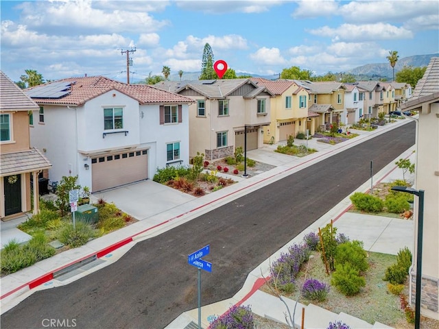 3069 Acebo Dr, Pomona, CA 91767 - view of road featuring a residential view, sidewalks, and curbs