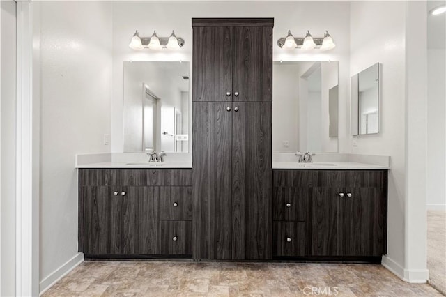 3069 Acebo Dr, Pomona, CA 91767 - bathroom with a sink, baseboards, and two vanities