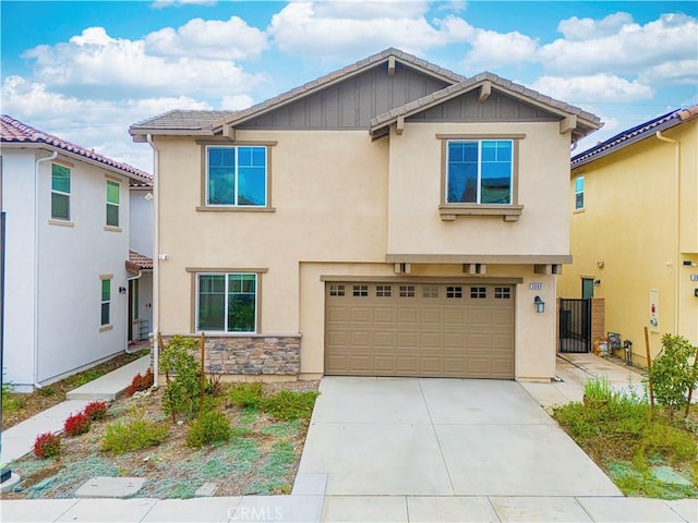 3069 Acebo Dr, Pomona, CA 91767 - view of front of home with concrete driveway, an attached garage, fence, and stucco siding