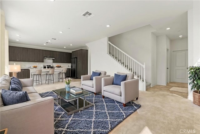 3069 Acebo Dr, Pomona, CA 91767 - living area with recessed lighting, light colored carpet, visible vents, and stairway