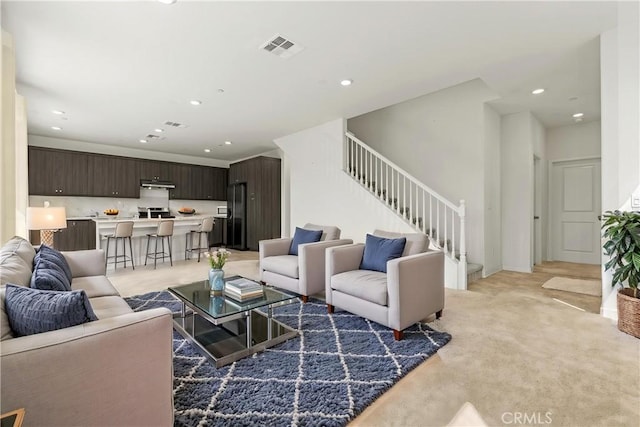 3069 Acebo Dr, Pomona, CA 91767 - living area featuring stairs, recessed lighting, and light carpet