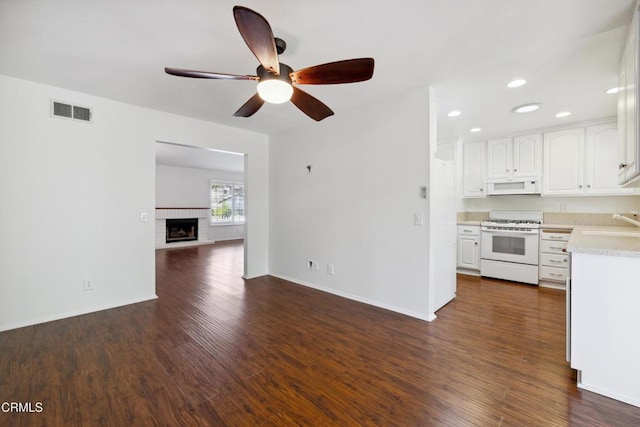 5216 Hillridge Dr, Camarillo, CA 93012 - kitchen with white appliances, light countertops, open floor plan, a ceiling fan, and white cabinets