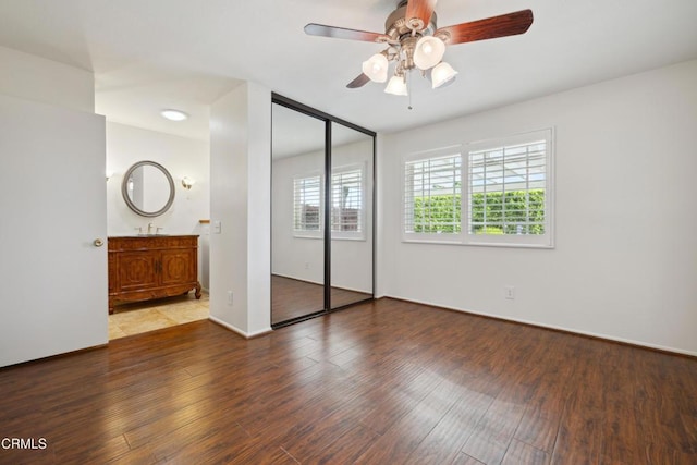 5216 Hillridge Dr, Camarillo, CA 93012 - unfurnished bedroom featuring wood finished floors, a closet, ceiling fan, and ensuite bath