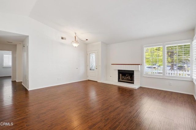 5216 Hillridge Dr, Camarillo, CA 93012 - unfurnished living room featuring plenty of natural light, dark wood-style floors, and a brick fireplace