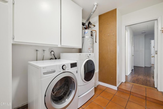 5216 Hillridge Dr, Camarillo, CA 93012 - washroom with water heater, washing machine and clothes dryer, light tile patterned floors, and cabinet space