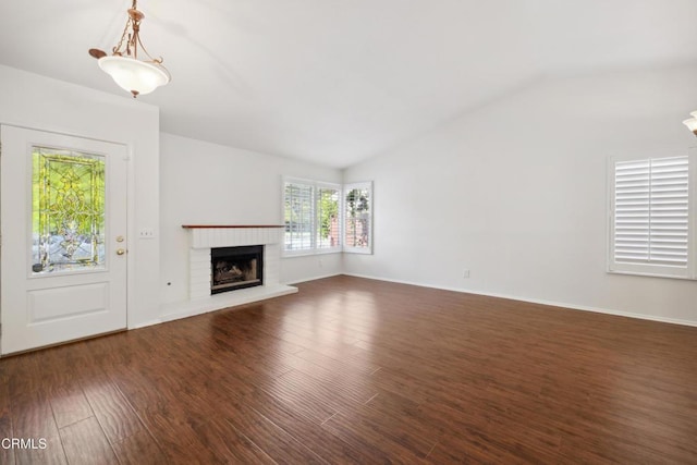 5216 Hillridge Dr, Camarillo, CA 93012 - unfurnished living room featuring vaulted ceiling, dark wood-style floors, and a brick fireplace