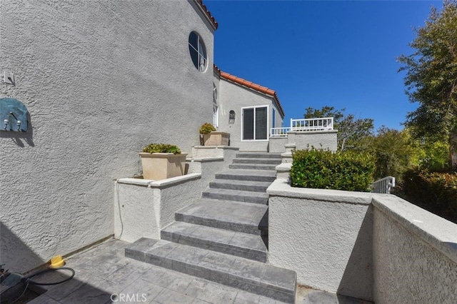 view of patio / terrace featuring stairway