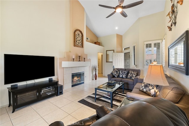 41497 Princeville Ln, Palm Desert, CA 92211 - living area with a tiled fireplace, light tile patterned floors, ceiling fan, and high vaulted ceiling