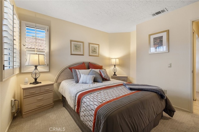 41497 Princeville Ln, Palm Desert, CA 92211 - bedroom with a textured ceiling, light colored carpet, baseboards, and visible vents