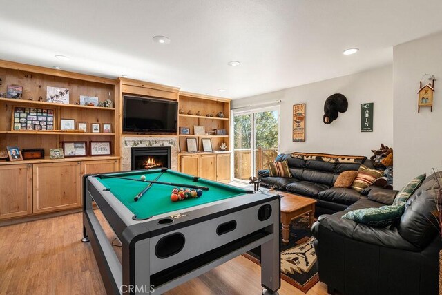 27721 Caribou Dr, Lake Arrowhead, CA 92352 - recreation room featuring light wood-type flooring, billiards table, recessed lighting, and a lit fireplace