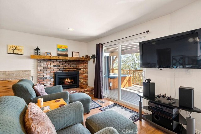 27721 Caribou Dr, Lake Arrowhead, CA 92352 - living area featuring light wood-style floors and a brick fireplace