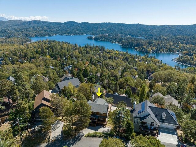 27721 Caribou Dr, Lake Arrowhead, CA 92352 - drone / aerial view of a forest and a water and mountain view