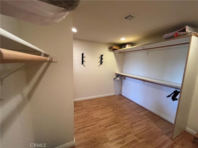 27721 Caribou Dr, Lake Arrowhead, CA 92352 - spacious closet featuring wood finished floors