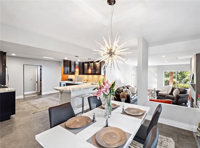 dining space with baseboards and recessed lighting