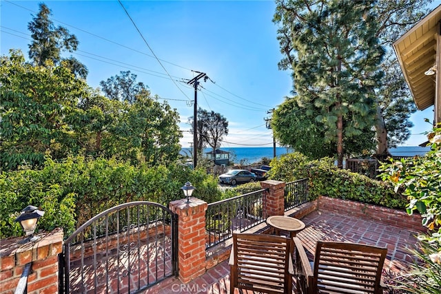 view of patio with a gate