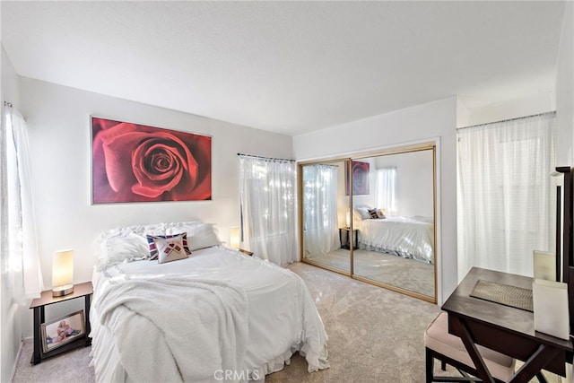 carpeted bedroom with a closet