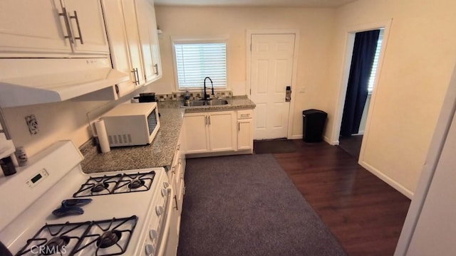 Palmdale, CA 93591 - kitchen with white appliances, extractor fan, dark wood-style floors, and white cabinetry