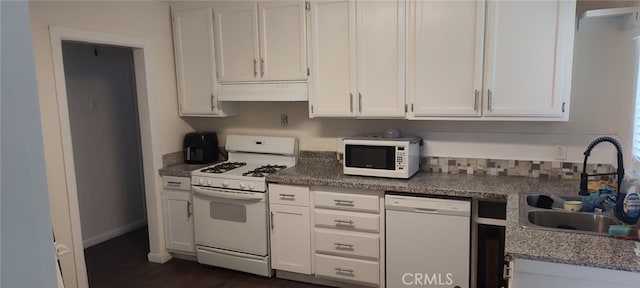 Palmdale, CA 93591 - kitchen featuring white appliances, white cabinets, under cabinet range hood, dark wood finished floors, and stone counters