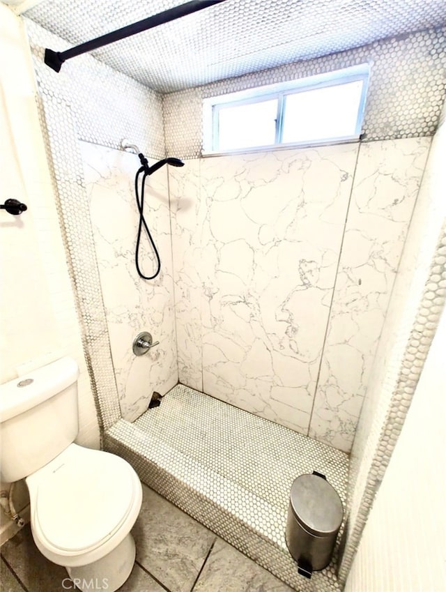 Palmdale, CA 93591 - bathroom featuring tiled shower and toilet