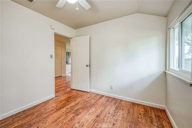 8029 Fruitland Ave, Winton, CA 95388 - unfurnished room featuring light wood-type flooring, ceiling fan, baseboards, and lofted ceiling