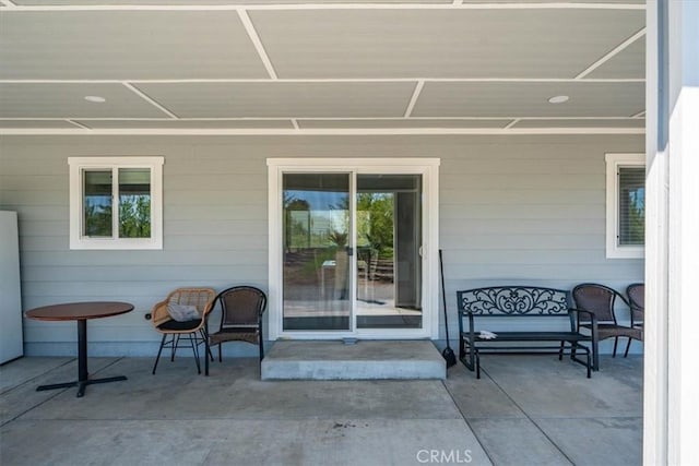 entrance to property featuring a patio